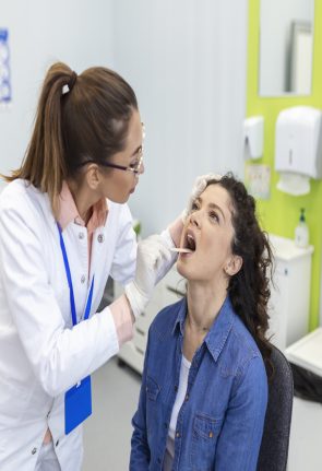 female-patient-opening-her-mouth-doctor-look-her-throat-otolaryngologist-examines-sore-throat-patient (1)